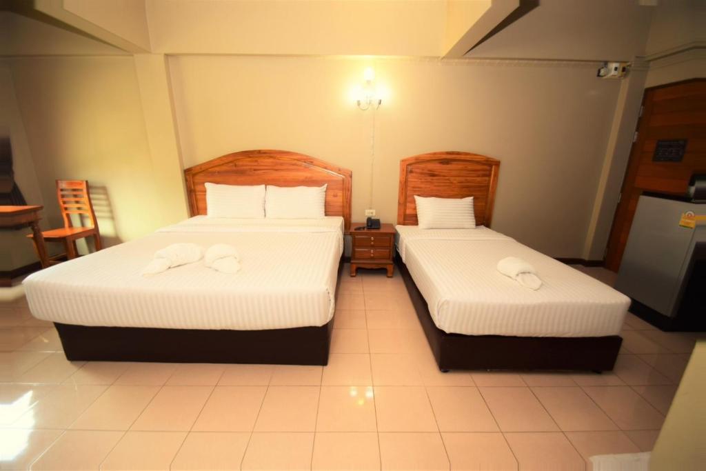 Postel nebo postele na pokoji v ubytování Best LD Hotel โรงแรมเบส แอลดี