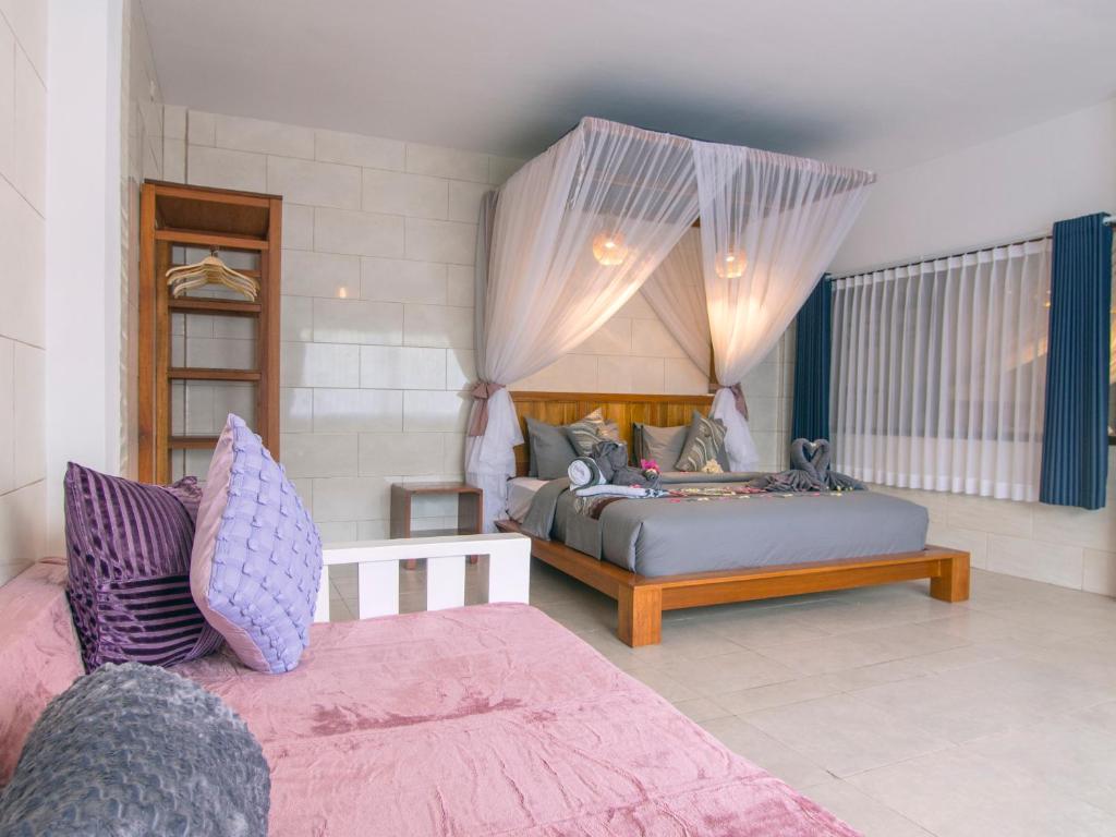 Postel nebo postele na pokoji v ubytování CoCo Breeze Spa Hotel