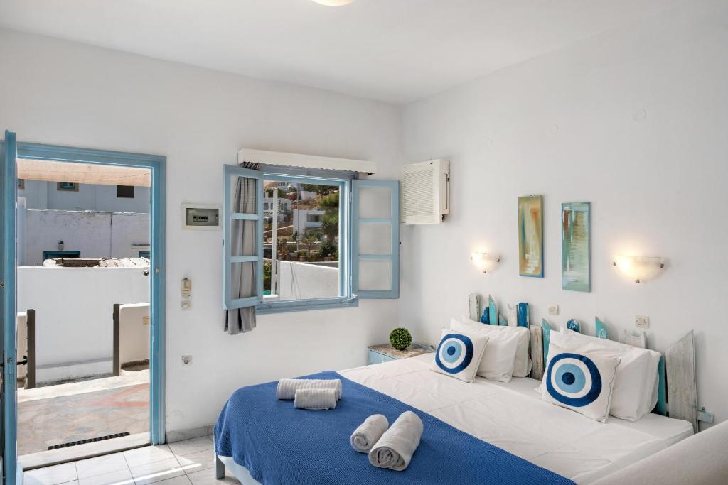 Postel nebo postele na pokoji v ubytování Pico Bello Patmos 10