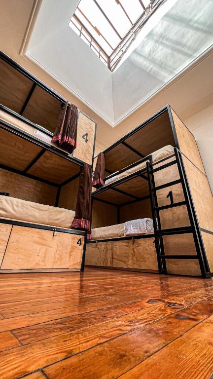 Letto o letti in una camera di Black Llama Hostel Cusco