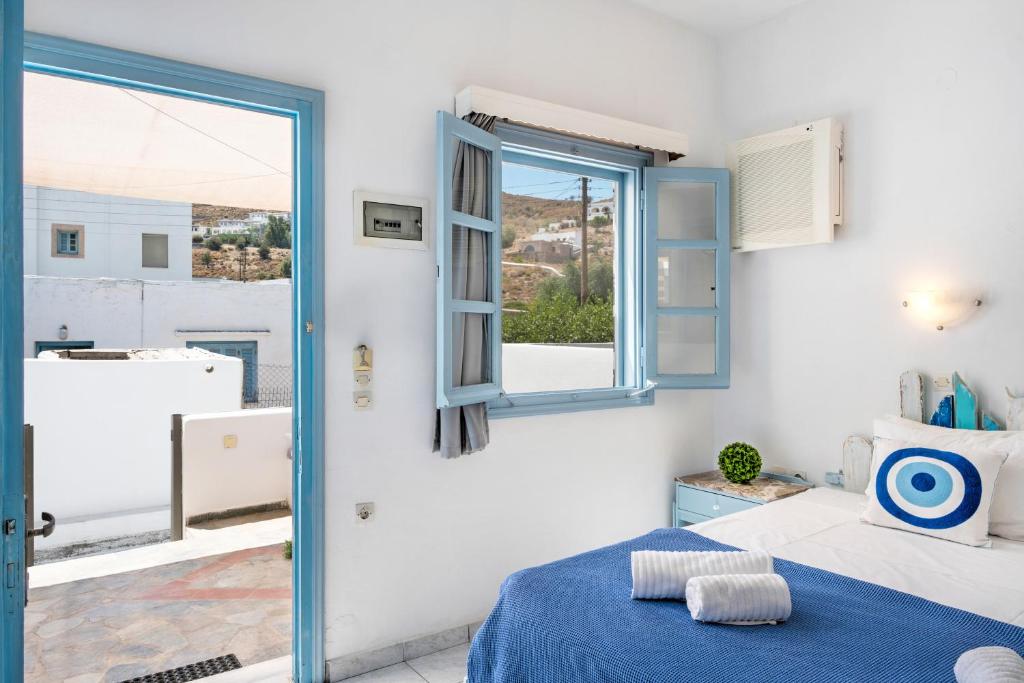 Postel nebo postele na pokoji v ubytování Pico Bello Patmos 10