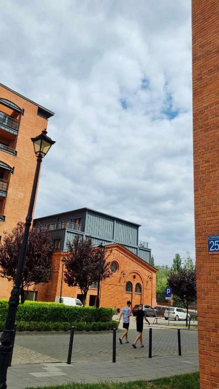 City Host Lofty Tymienieckiego - One-Bedroom Apartment