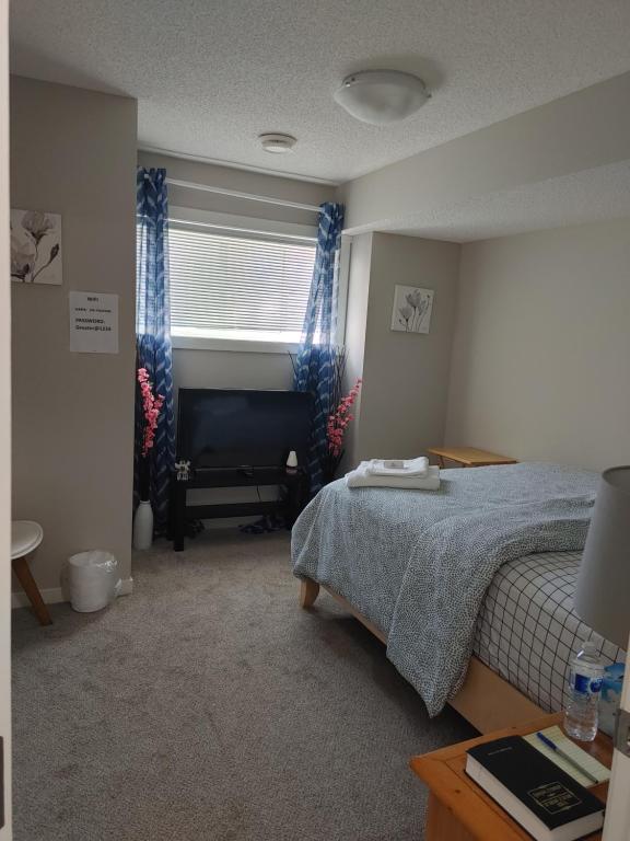 Postel nebo postele na pokoji v ubytování Genesis Townhouse