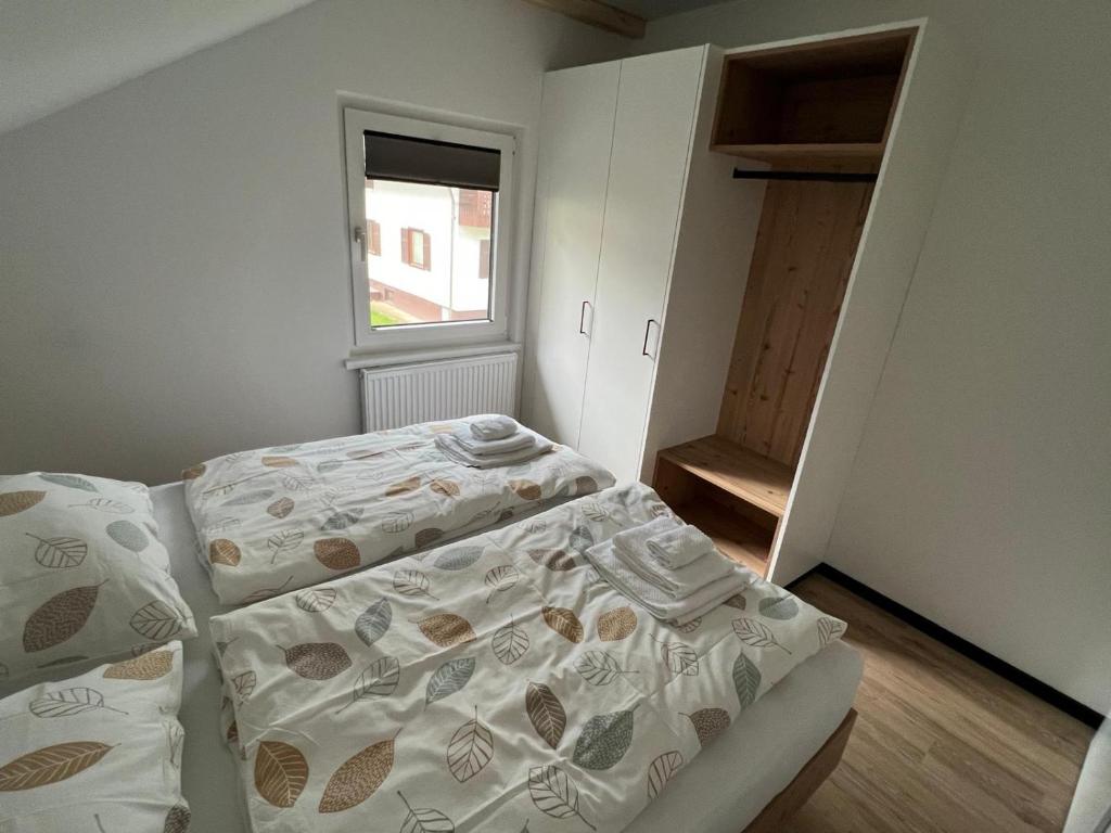 Postel nebo postele na pokoji v ubytování Hiša Rodica