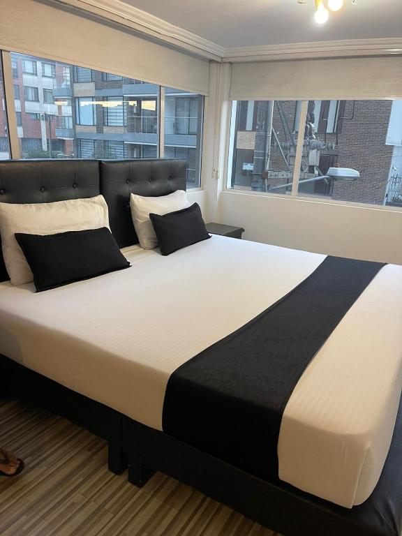 Postel nebo postele na pokoji v ubytování Hotel AMBAR KING