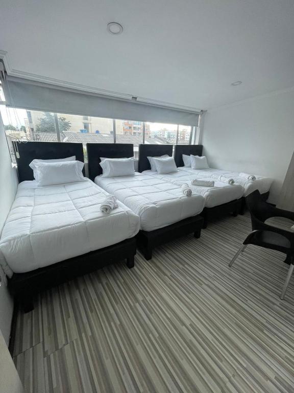 Postel nebo postele na pokoji v ubytování Hotel AMBAR KING