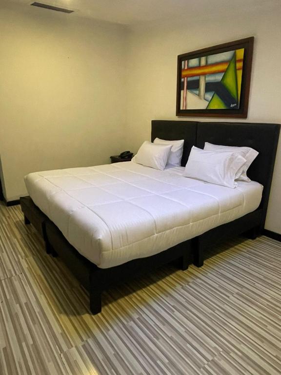 Postel nebo postele na pokoji v ubytování Hotel AMBAR KING
