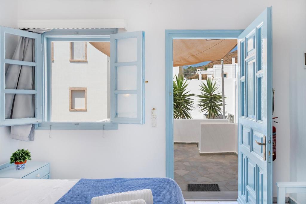 Postel nebo postele na pokoji v ubytování Pico Bello Patmos 14