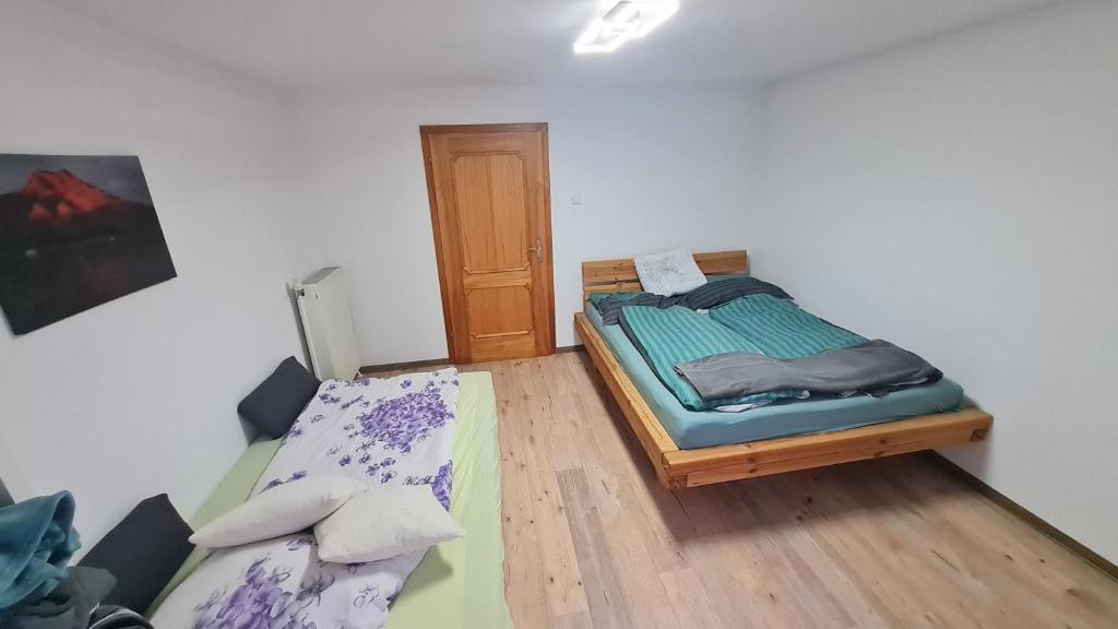 Postel nebo postele na pokoji v ubytování Appartement Demelfischer am See