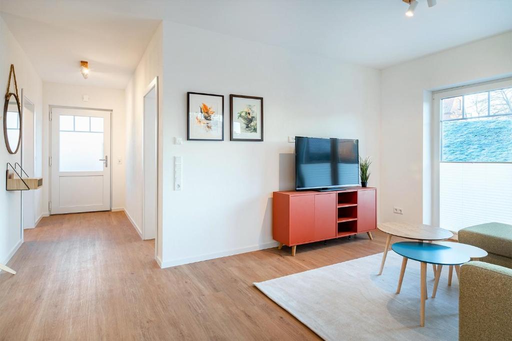 TV a/nebo společenská místnost v ubytování Apartment am Deich 01