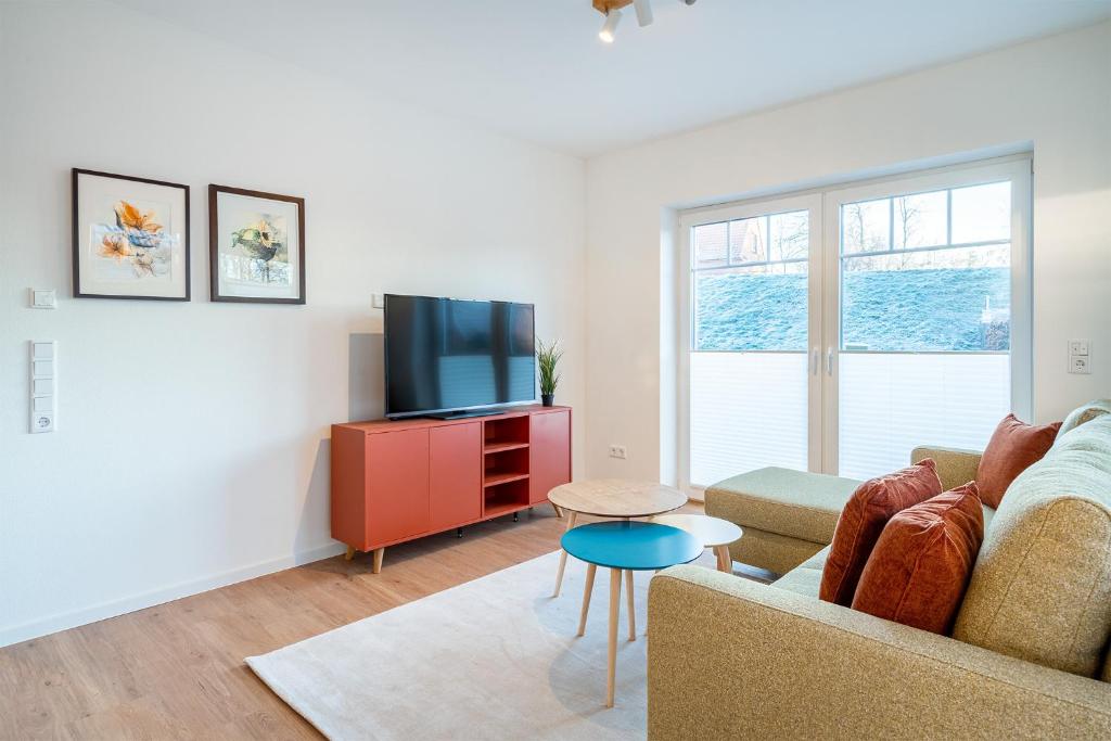 TV a/nebo společenská místnost v ubytování Apartment am Deich 01