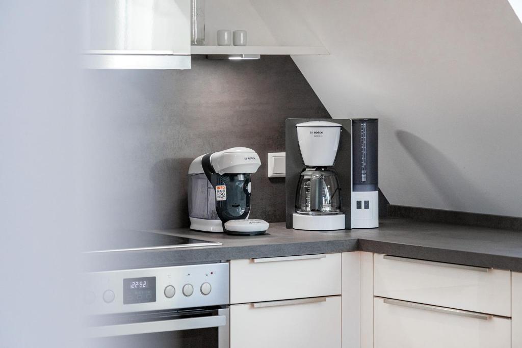 Kuchyň nebo kuchyňský kout v ubytování Apartment am Deich 04