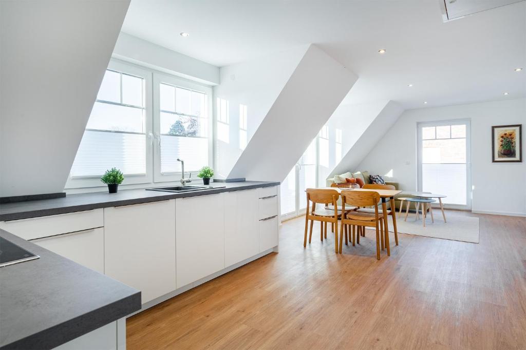 Kuchyň nebo kuchyňský kout v ubytování Apartment am Deich 04
