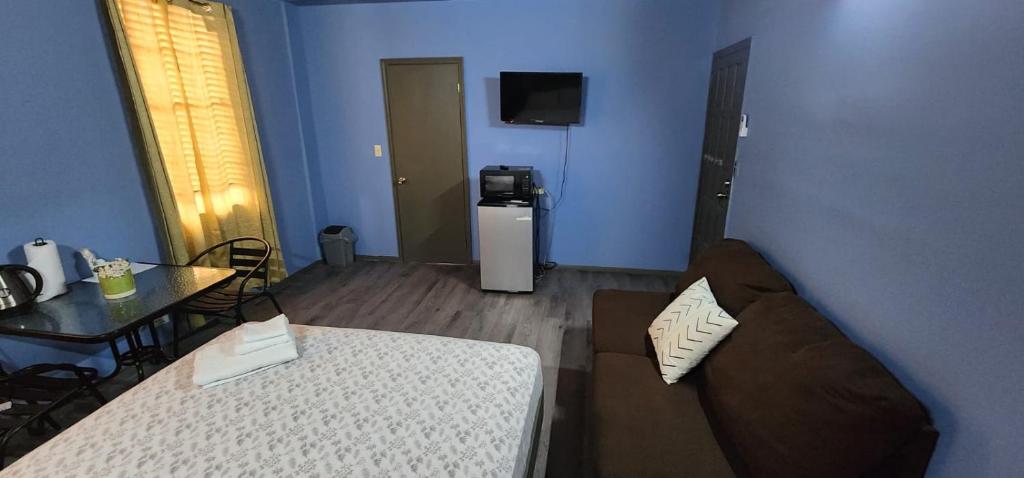 Postel nebo postele na pokoji v ubytování JJ Guest House