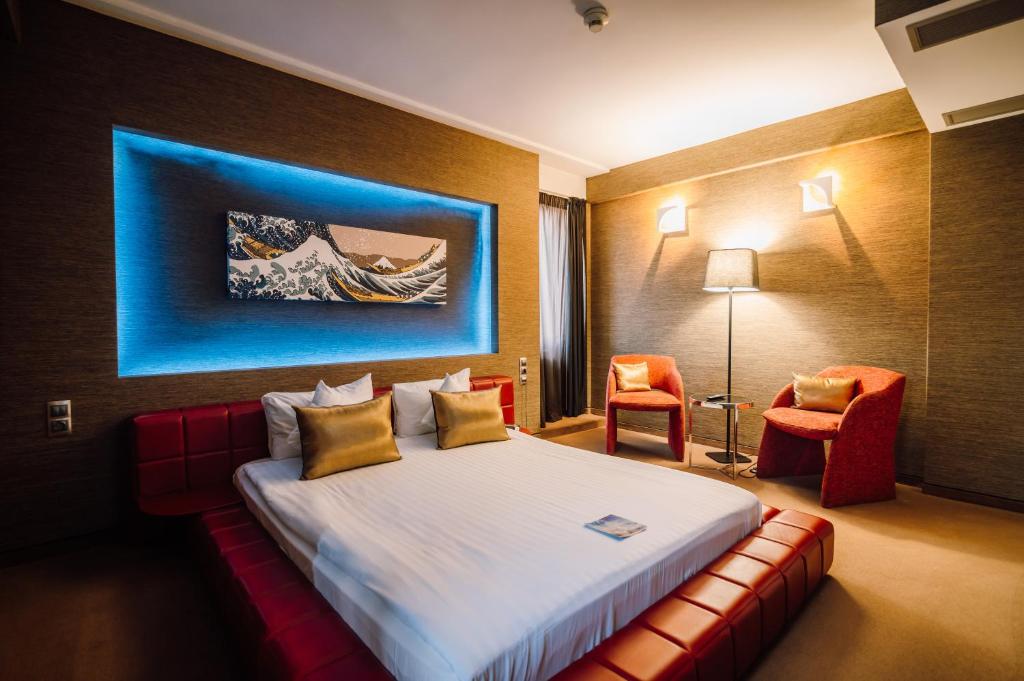 Postel nebo postele na pokoji v ubytování Plaza V Executive Hotel