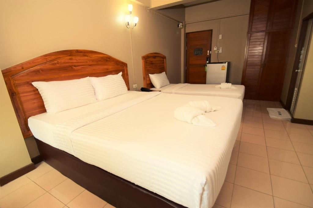 Postel nebo postele na pokoji v ubytování Best LD Hotel โรงแรมเบส แอลดี