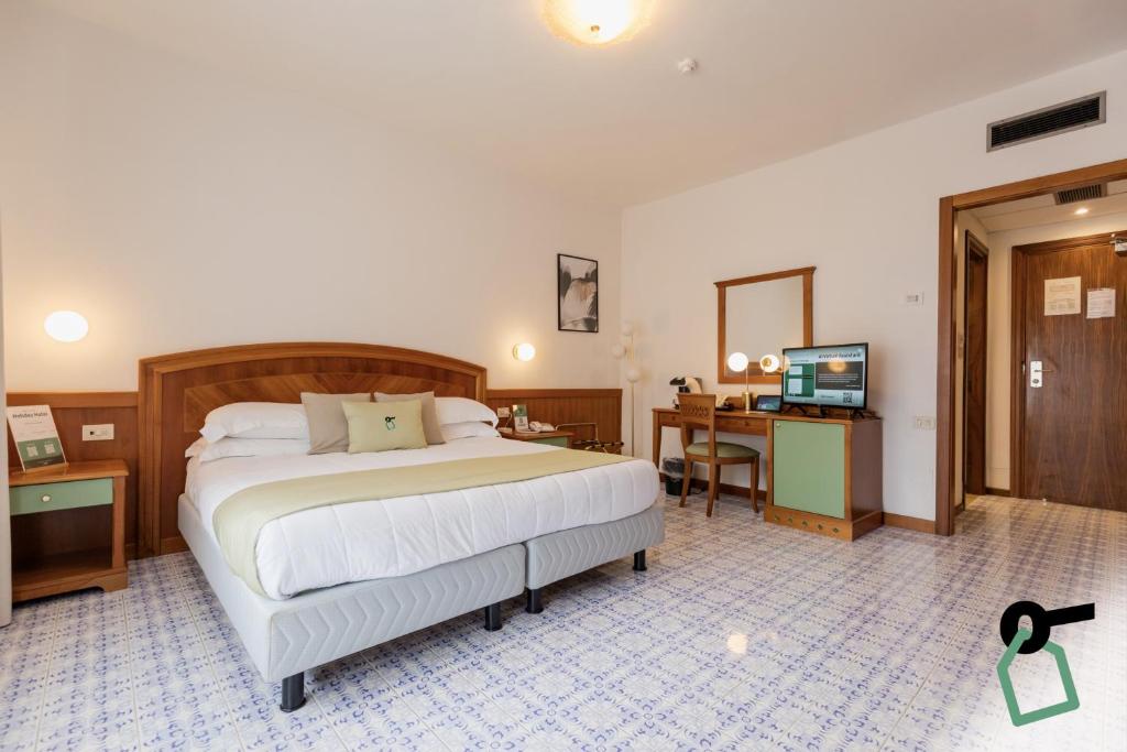 Postel nebo postele na pokoji v ubytování HOTIDAY Room Collection - Sorrento