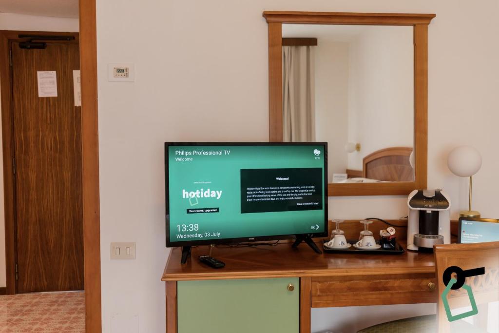 TV a/nebo společenská místnost v ubytování HOTIDAY Room Collection - Sorrento