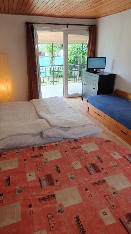 Postel nebo postele na pokoji v ubytování Kalmanka House