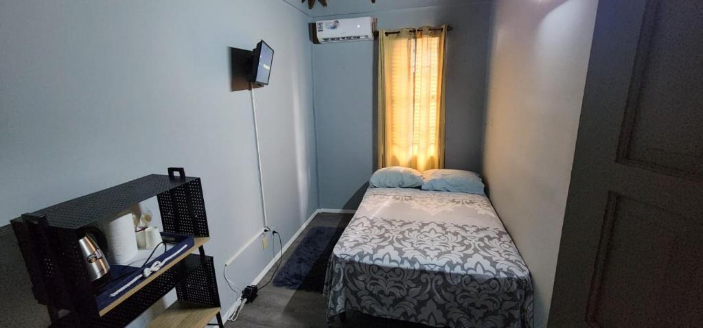 Postel nebo postele na pokoji v ubytování JJ Guest House
