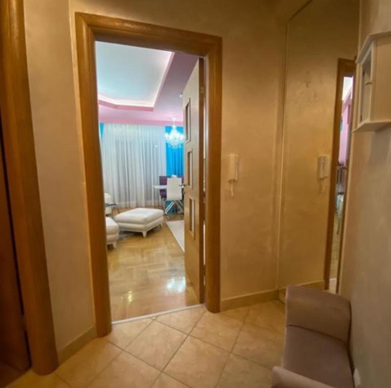 a hallway with a door open to a living room at Apartment Sonja Stari Aerdrom in Podgorica