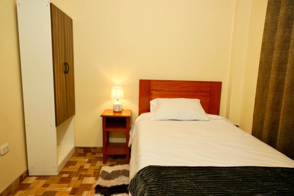 Postel nebo postele na pokoji v ubytování Casa Medina Hostal