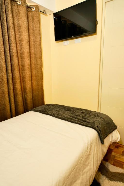Postel nebo postele na pokoji v ubytování Casa Medina Hostal