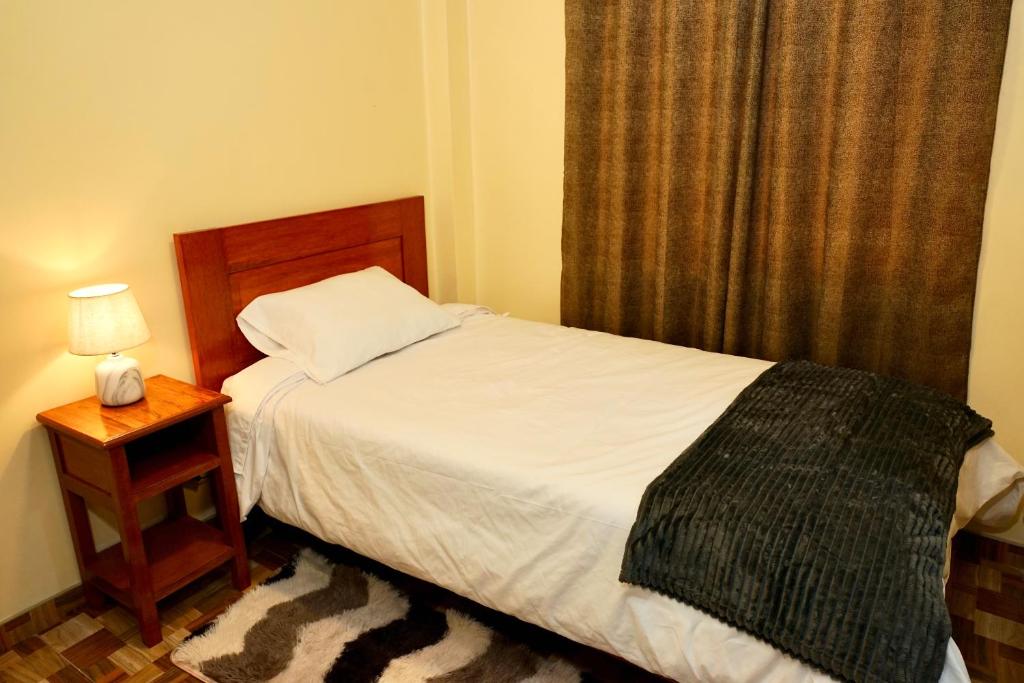 Postel nebo postele na pokoji v ubytování Casa Medina Hostal