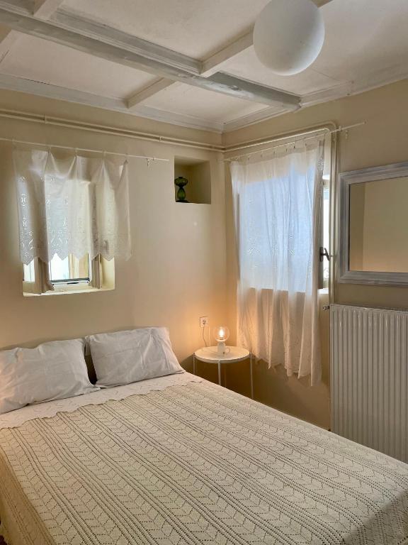 Postel nebo postele na pokoji v ubytování Gaea Studio