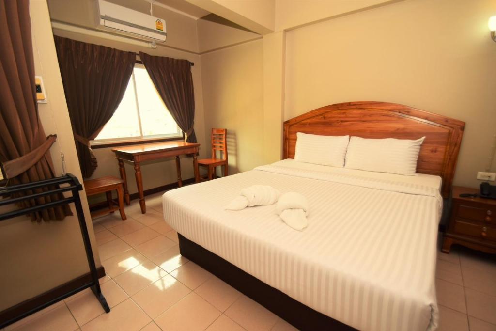 Postel nebo postele na pokoji v ubytování Best LD Hotel โรงแรมเบส แอลดี