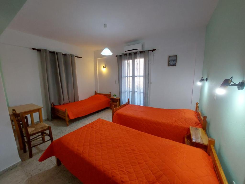 A bed or beds in a room at Koukos