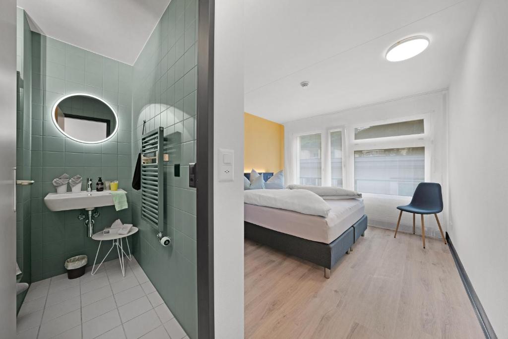 Postel nebo postele na pokoji v ubytování B&B Bellagio Davos