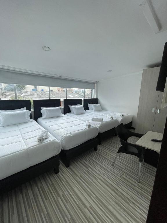 Postel nebo postele na pokoji v ubytování Hotel AMBAR KING
