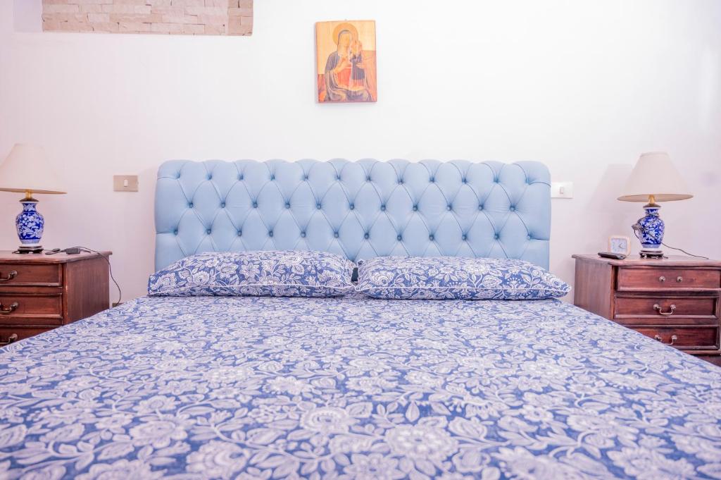 Łóżko lub łóżka w pokoju w obiekcie Dimora Belvedere