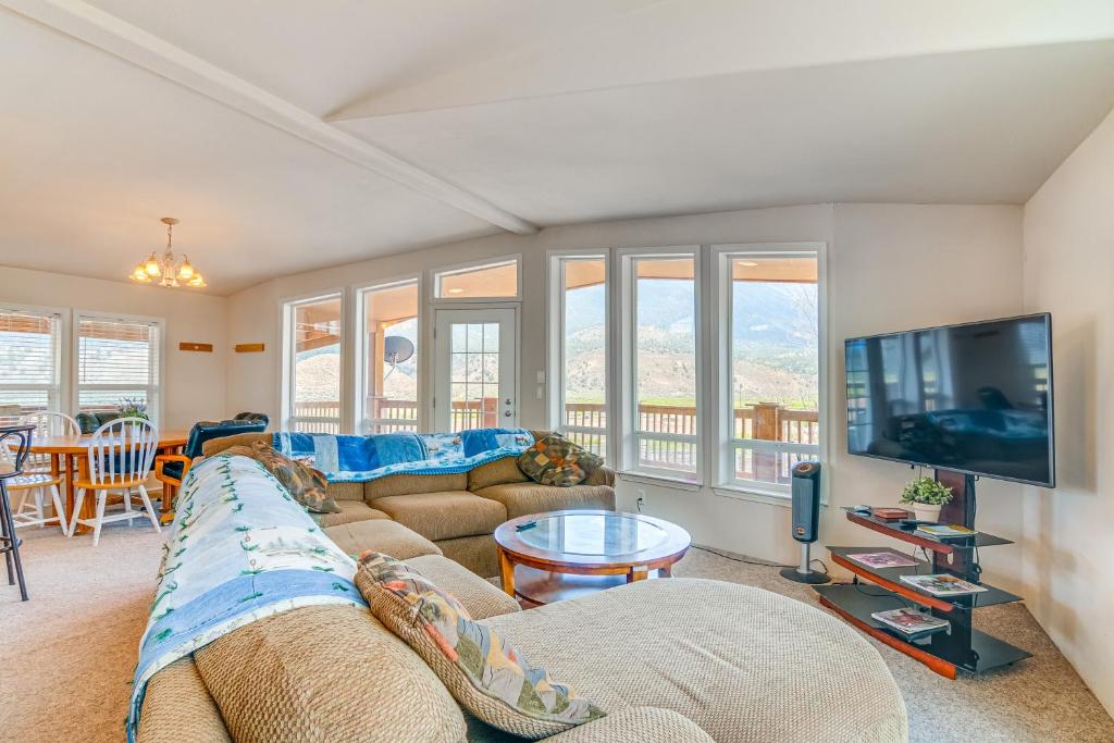 a living room with a couch and a tv at Remote Kingston Cabin with Mtn Views Fish and ATV! in Antimony