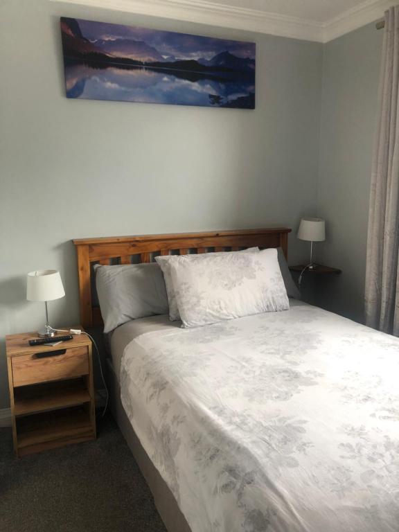 Postel nebo postele na pokoji v ubytování Manorlodge