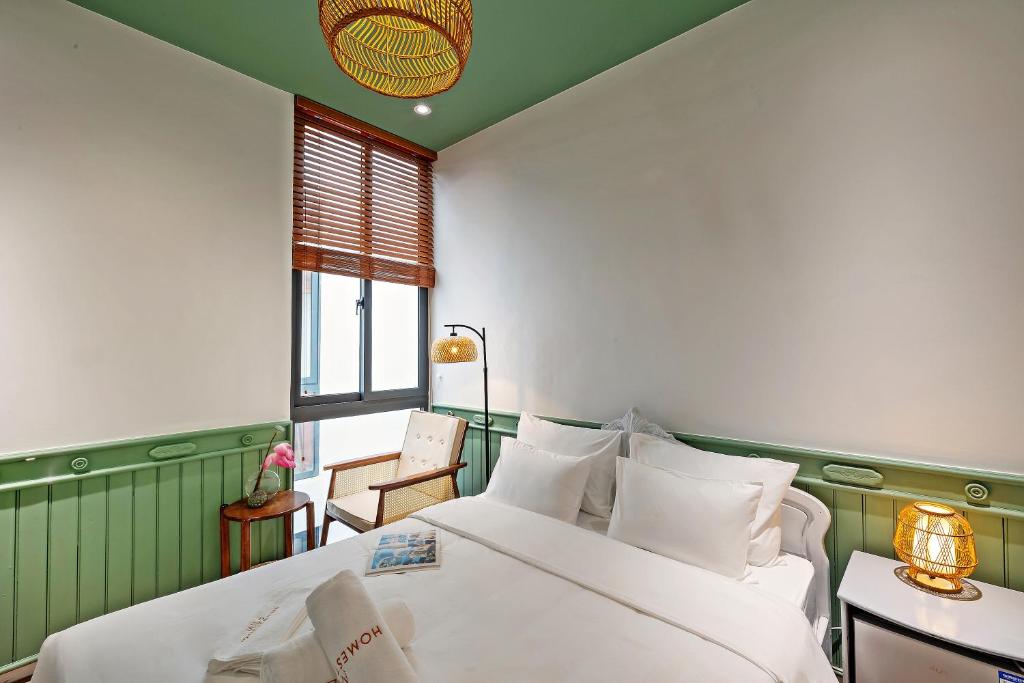 Giường trong phòng chung tại MiLa - Homestay in Hue