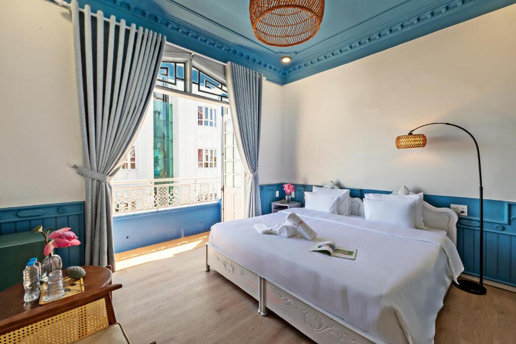 Giường trong phòng chung tại MiLa - Homestay in Hue