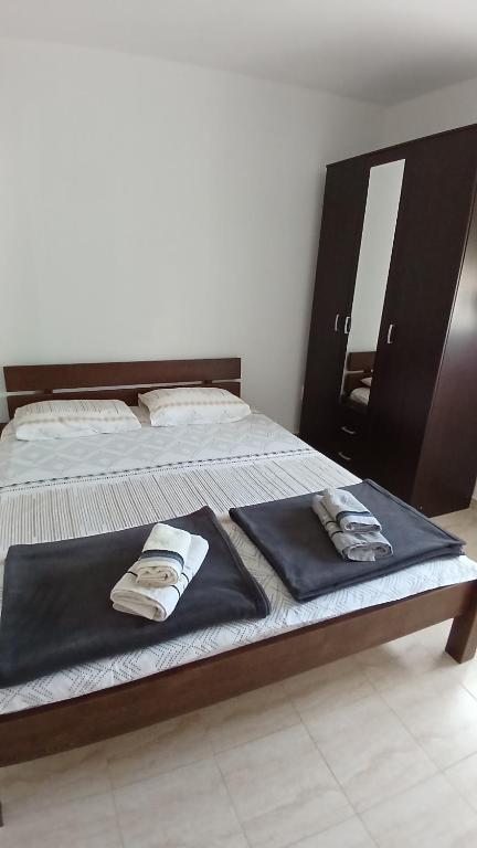 Postel nebo postele na pokoji v ubytování MarBis Apartmani near the sea