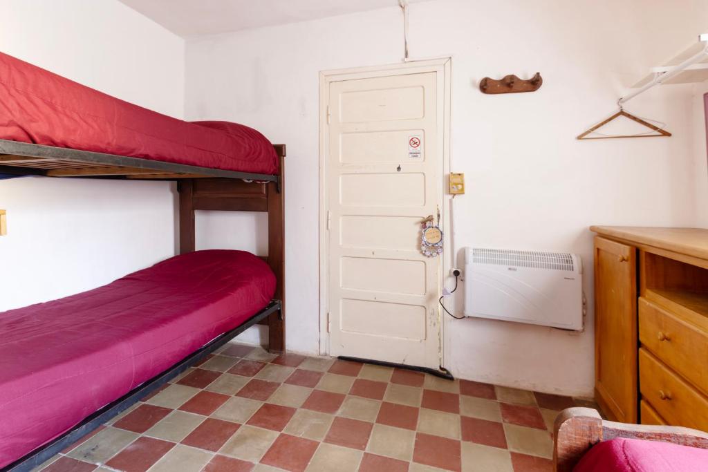 Postel nebo postele na pokoji v ubytování Puerta Azul Hostel