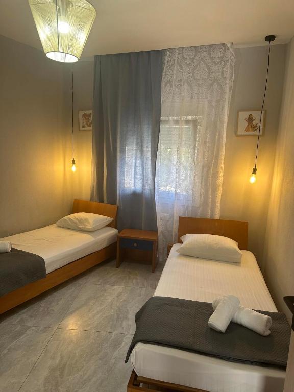 Postel nebo postele na pokoji v ubytování Amela House