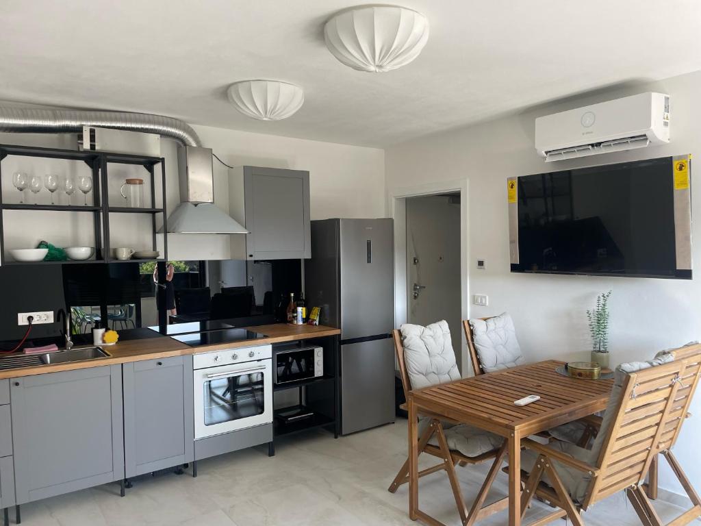a kitchen with a table and a dining room at Apartment De Frata in Frata