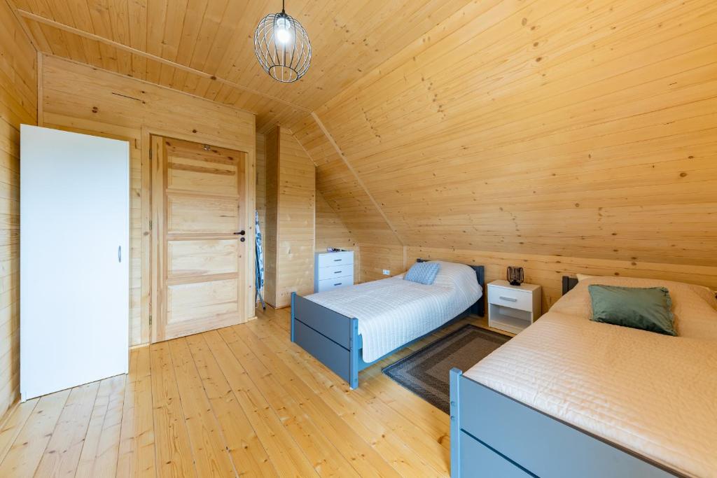 Postel nebo postele na pokoji v ubytování Kaszubskie Klimaty Grabówko