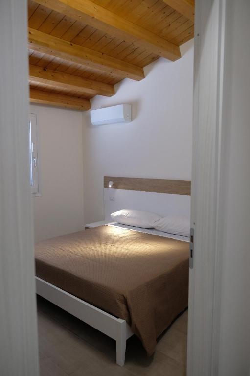 Postel nebo postele na pokoji v ubytování Salerno Rooms