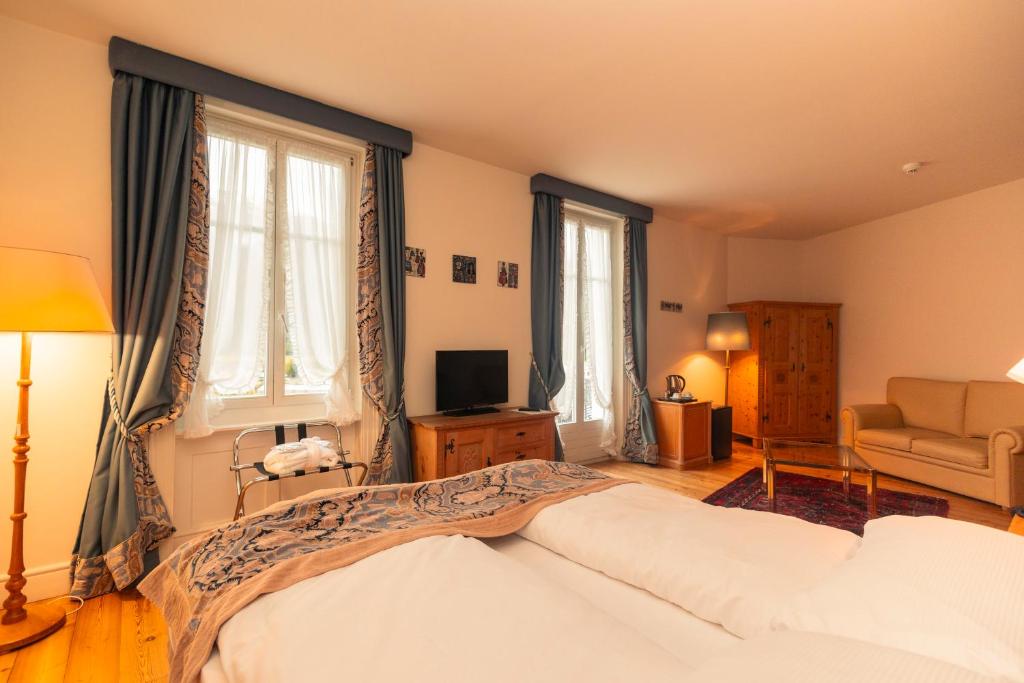Postel nebo postele na pokoji v ubytování Hotel Bernina 1865 by Kleos Group Collection