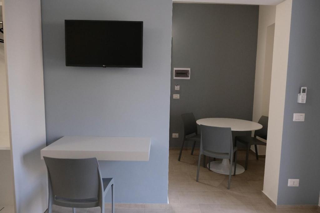 TV a/nebo společenská místnost v ubytování Salerno Rooms