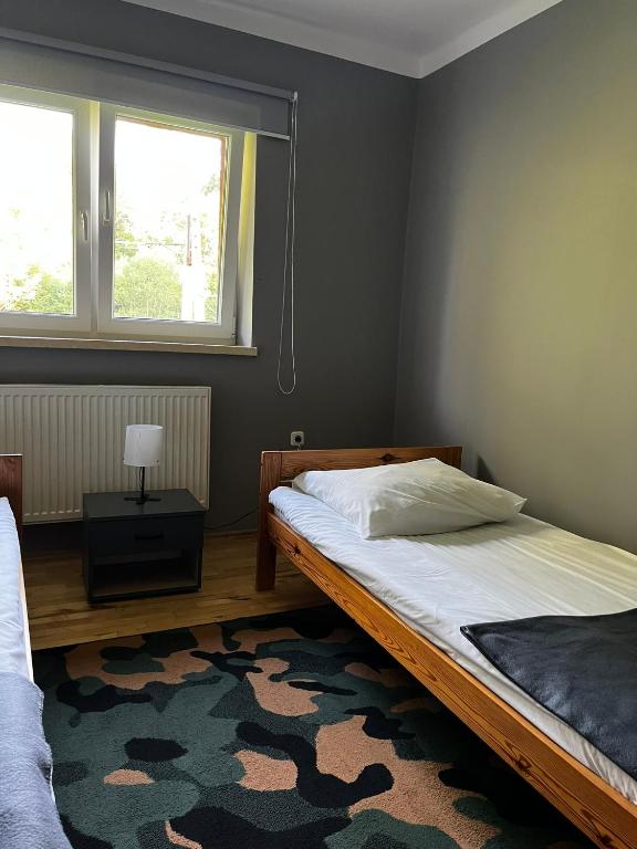 Posteľ alebo postele v izbe v ubytovaní Ośrodek VolfCamp Kwaszenina
