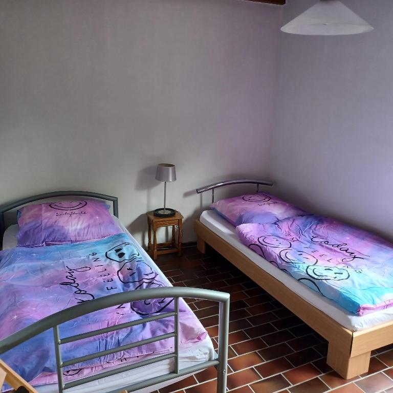 Postel nebo postele na pokoji v ubytování Ferienhaus mit Meerblick