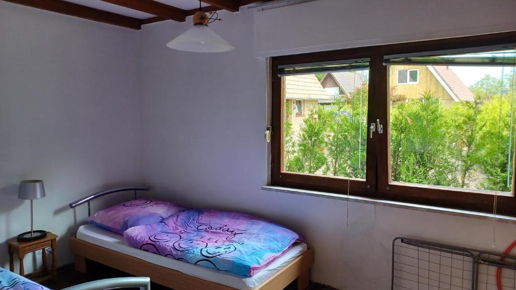Postel nebo postele na pokoji v ubytování Ferienhaus mit Meerblick