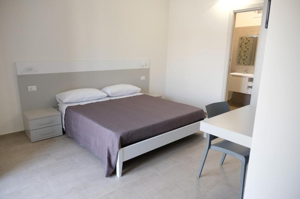 Postel nebo postele na pokoji v ubytování Salerno Rooms